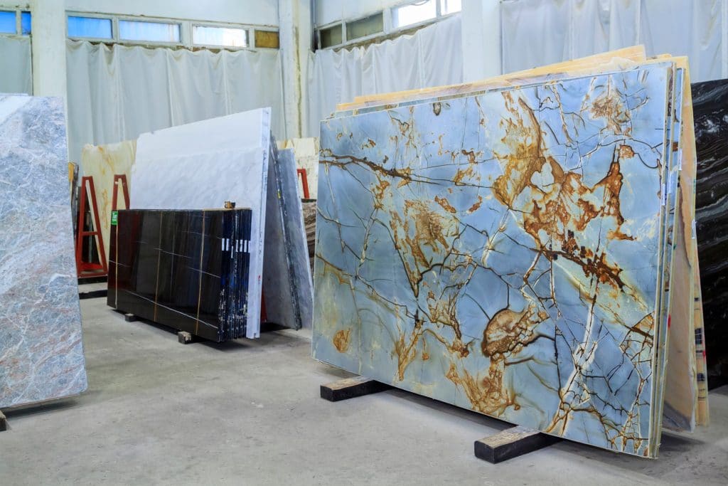 Colorful marble slabs in store show room. Quartzite slabs are prepared for sale in store yard